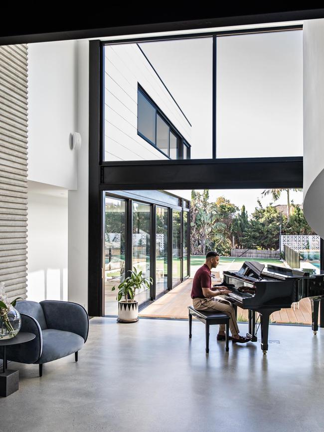 Guy Sebastian playing a baby grand piano at his luxurious Maroubra mansion. Picture: Instagram