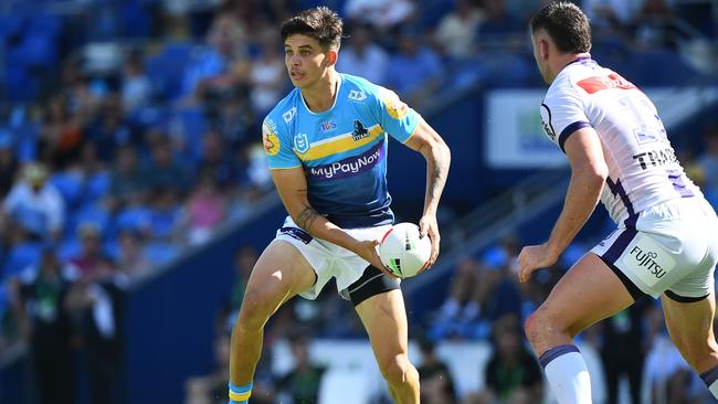 Jayden Campbell of the Titans passes the ball during the round three NRL match between the Gold Coast Titans and the Melbourne Storm at Cbus Super Stadium on March 18, 2023 in Gold Coast, Australia. (Photo by Jono Searle/Getty Images)