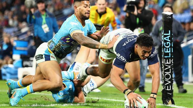 Cowboys winger Murray Taulagi scores in the corner against the Titans. Picture: Chris Hyde/Getty Images