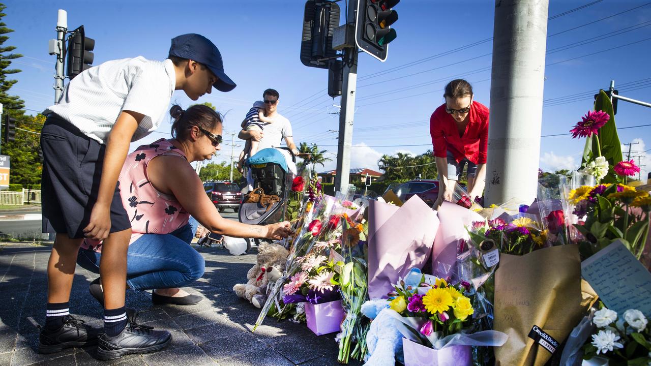 Queenslanders lay flowers at the scene where Mr Field and Ms Leadbetter were killed. Picture: Nigel Hallett