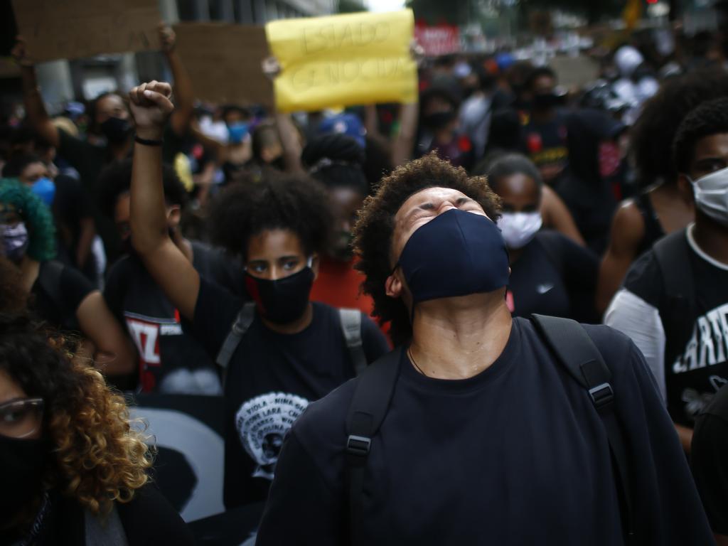 Protesters wearing masks during a protest amid the coronavirus pandemic in Rio de Janeiro, Brazil. Picture: Bruna Prado/Getty Images