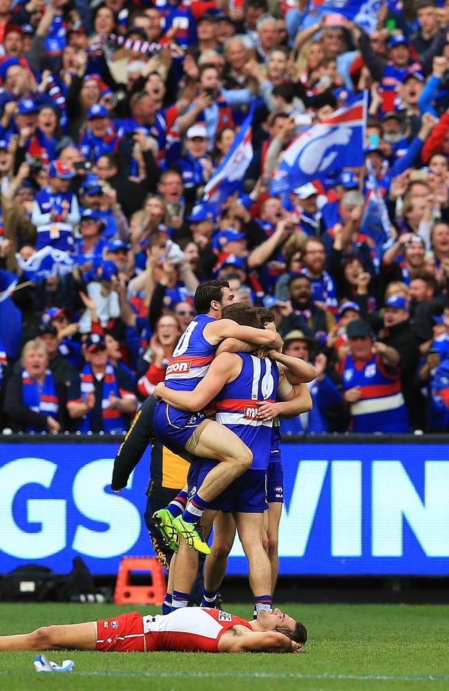 Bulldogs players and fans celebrate after the Grand Final siren. Picture: Toby Zerna