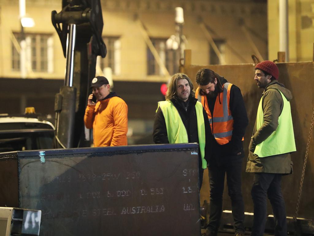 Dark Mofo creative director Leigh Carmichael watches work in Macquarie Street, Hobart on the hole that will house the chamber performance artist Mike Parr will live in for 72 hours during the festival. Picture: NIKKI DAVIS-JONES