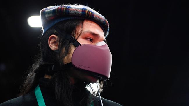 Alexander Mordvinoff demonstrates the AIRXOM mask for active protection from the effects of air pollution, bacteria, and viruses including Covid-19 during CES 2022. Picture: Patrick T. FALLON / AFP