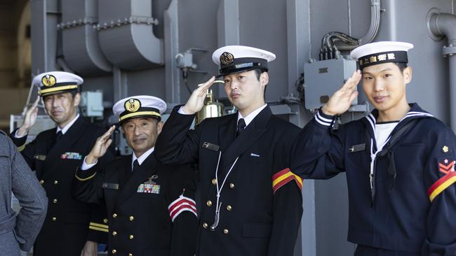 Japanese navy personnel greet guests as they board the JS Izumo in Brisbane recently. Picture: Matthew Poon