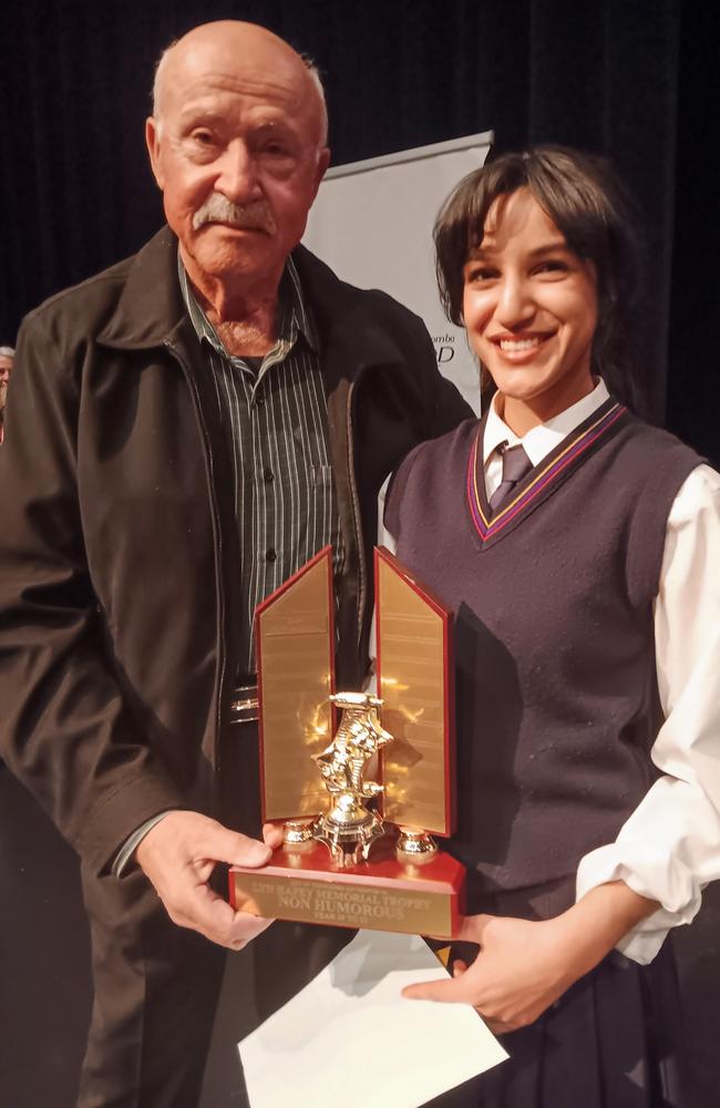 Speech and drama student Mashal Imam is presented with the Lyn Hafey Memorial Trophy by Lyn's partner Mario Mastrangelo at the 78th City of Toowoomba Eisteddfod. Lyn was a speech and drama teacher in Toowoomba and was involved in the eisteddfod for many years. Picture: Supplied