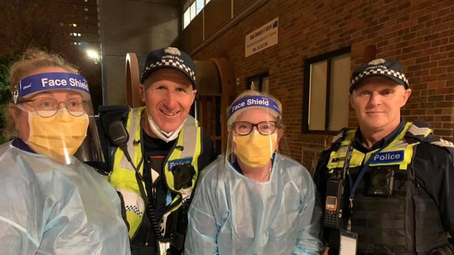 Knox Private Hospital nurse Lisa Peters with fellow nurse and police at the Melbourne towers. Picture: Lisa Peters