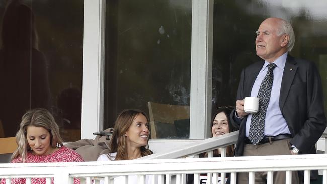 Bonnie Paine, Becky Boston and Cat McAteer with former prime minister John Howard. Picture: Getty Images