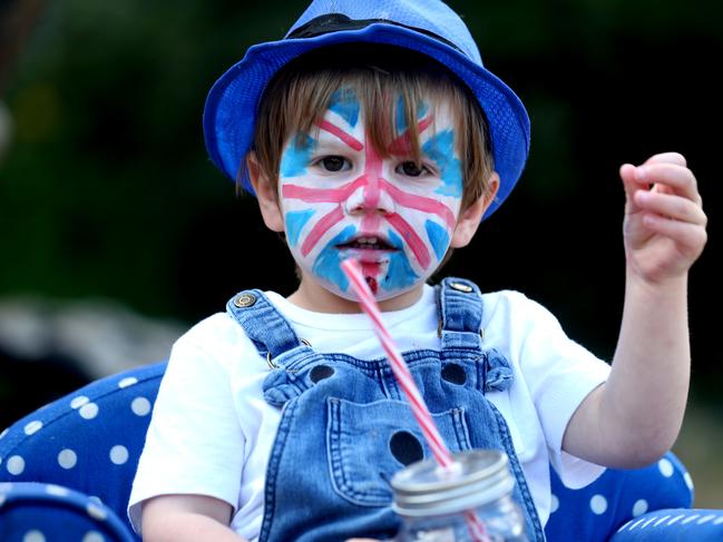 A young boy with a Union Jack painted on his face celebrates VE Day. Picture: Getty