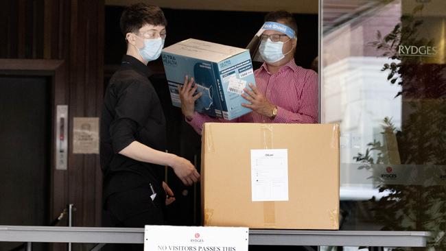 Staff at Rydges on Swanston Hotel in Melbourne receive a delivery of PPE. Picture: NCA NewsWire/David Geraghty