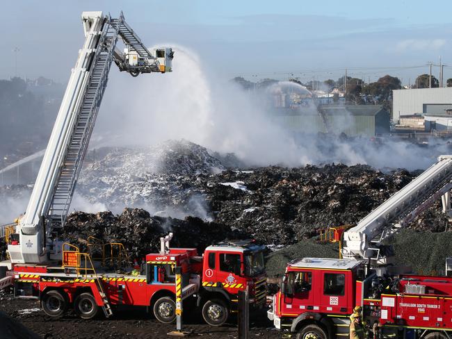 Firefighters at the same Coolaroo recycling plant in July last year. Picture: David Crosling