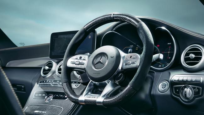 The carbon-fibre-fitted steering wheel.