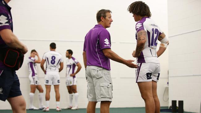 Storm Coach Craig Bellamy talks with Kevin Proctor before the match. Melbourne 8th February. Pic by Colleen Petch.