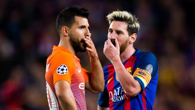Sergio Aguero (L) of Manchester City FC speaks with Lionel Messi (R) of FC Barcelona.
