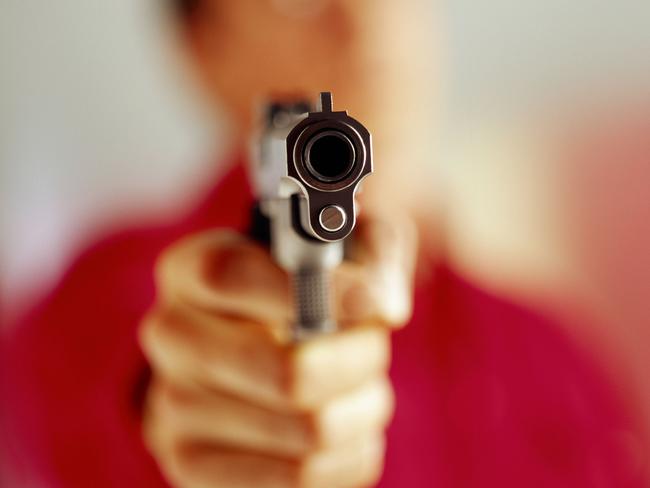 Generic image of a man aiming a gun.