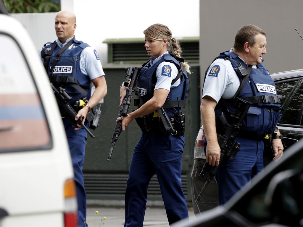 Armed police patrol outside a mosque in central Christchurch, New Zealand, Friday, March 15, 2019. (AP Photo/Mark Baker)