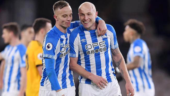 Huddersfield will be relegated at the end of the season, but Aaron Mooy (right) is set to stay in the Premier League. Picture: Getty Images 