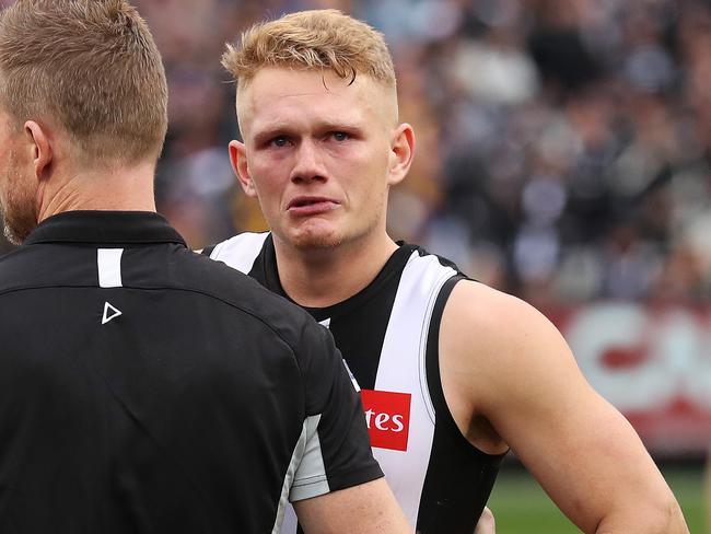 Dejected Adam Treloar and Collingwood coach Nathan Buckley after losing to the West Coast Eagles in the 2018 AFL Grand Final at the MCG. Picture. Phil Hillyard