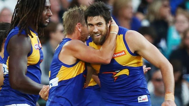 Josh Kennedy gets a hug from Mark LeCras.