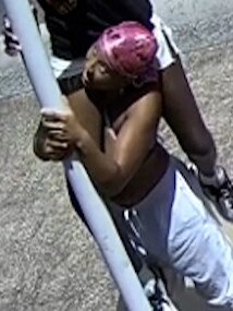 Police are appealing for assistance to speak with the woman in this CCTV still. She is shown wearing a camouflage print bikini top, white shorts, dark shoes and a pink headscarf.