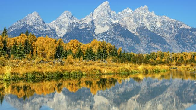 ESCAPE: YELLOWSTONE NATIONAL PARK .. Andy Smeerdijk story .. . Looking across Jackson Lake towards the Teton Range, Grand Teton National Park, near Yellowstone National Park. Picture: iStock