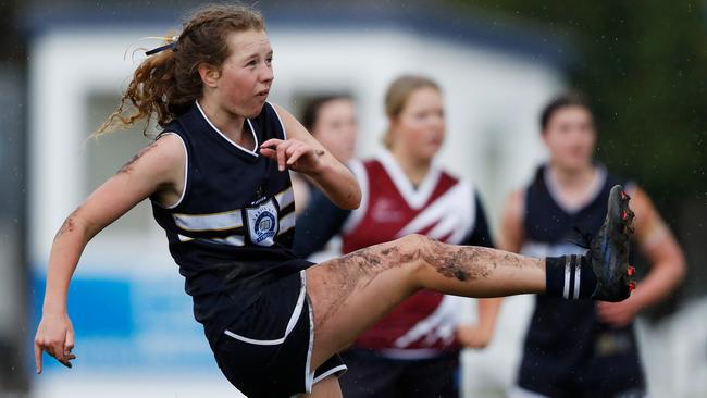 Lily Wenk of Caulfield Grammar kicks a goal. Picture: Dylan Burns/AFL Photos via Getty Images