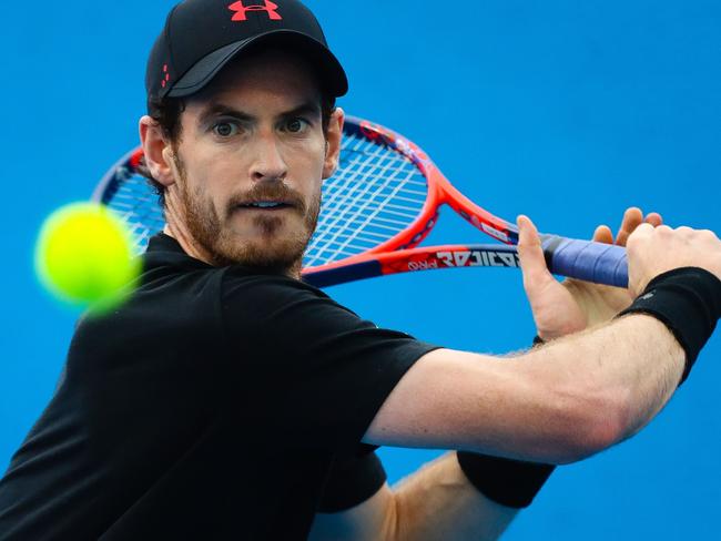 Britain's Andy Murray hits a return during training for his first round men's singles match at the Brisbane International tennis tournament at the Pat Rafter Arena in Brisbane on December 31, 2017.  / AFP PHOTO / Patrick HAMILTON / -- IMAGE RESTRICTED TO EDITORIAL USE - STRICTLY NO COMMERCIAL USE --