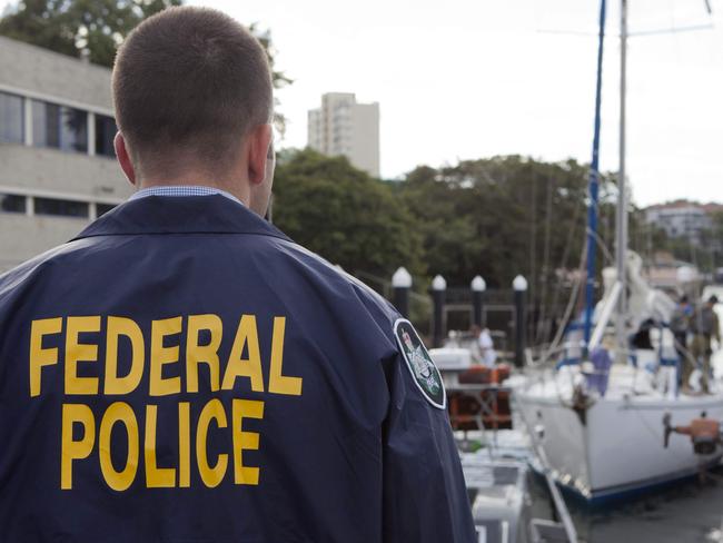 This handout photo released by the Australian Federal Police on February 6, 2017 shows a policeman guarding a yacht from which cocaine was seized on the New South Wales coast by the Australian Federal Police. Australia has made its largest cocaine haul ever after seizing a yacht carrying 1.4 tonnes of the drug with an estimated street value of Aus$312 million (US$239 million). The boat was stopped off the New South Wales coast on February 2 and six men were arrested, police said on February 6, following a two-and-a-half year joint investigation between Australia and New Zealand. / AFP PHOTO / Australian Federal Police / STR / RESTRICTED TO EDITORIAL USE - MANDATORY CREDIT "AFP PHOTO / AUSTRALIAN FEDERAL POLICE" - NO MARKETING NO ADVERTISING CAMPAIGNS - DISTRIBUTED AS A SERVICE TO CLIENTS - NO ARCHIVES