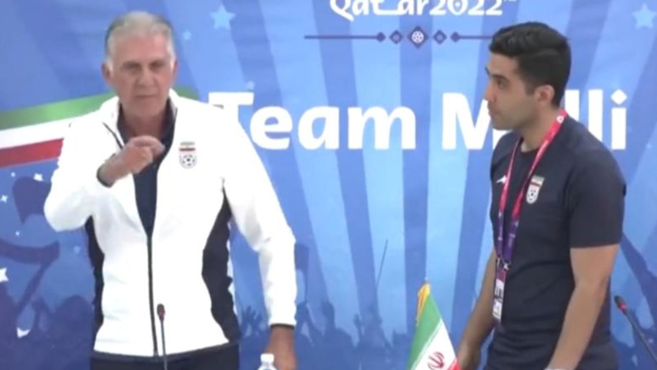 Iran's coach storms out of a press conference.
