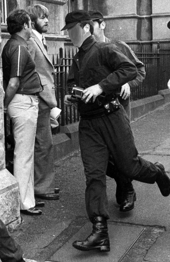 November 1979: Members of the Special Operations Group scramble outside the City Court in an unsuccessful bid to find Raymond “Chuck” Bennett’s killer. Picture: Herald Sun