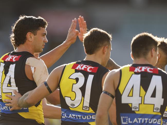 Tim Taranto of the Tigers celebrates a goal during round two with some of the Tigers’ youngsters. Picture: Darrian Traynor/Getty Images.