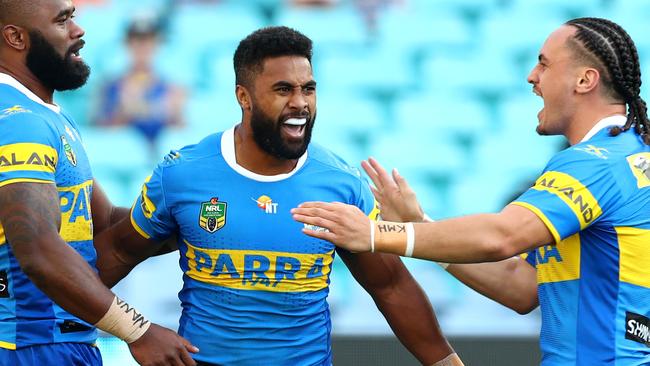 Brad Takairangi celebrates with Michael Jennings and Semi Radradra.