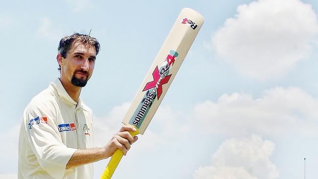 Jason Gillespie raises his bat in celebration of his double century against Bangladesh 11 years ago.