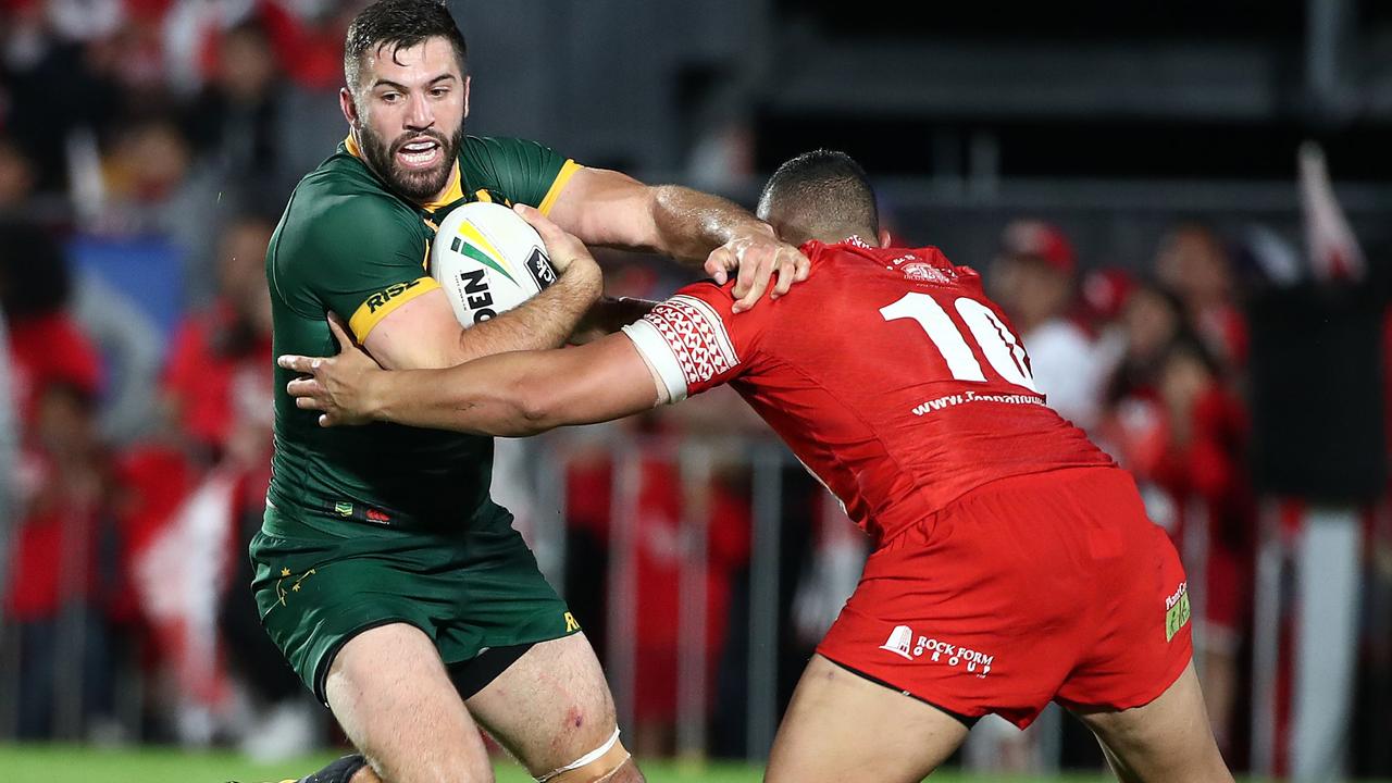 James Tedesco of Australia looks to find his way past the Tongan defence
