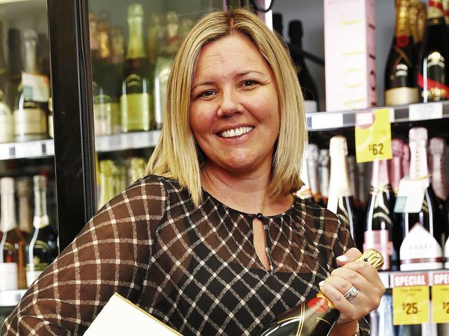 WEEKEND TELEGRAPH - 17/6/21Danielle Richardson, owner of "Cellarbrations" in Rozelle pictured filling the champagne fridge where some high end brands are becoming increasingly difficult to buy from overseas. Picture: Sam Ruttyn