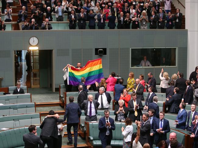 Celebrations after the Marriage Amendment (Definition and Religious Freedoms) Bill 2017 passes in the House of Representatives Chamber, at Parliament House in Canberra.