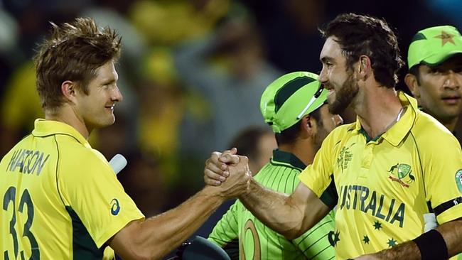 Watson and Maxwell congratulate each other after guiding Australia to victory against Pakistan.