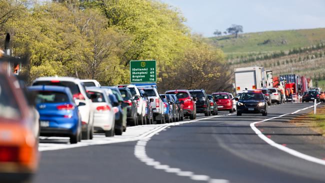 Traffic backed up on the Midland Highway near Ross after a fatal car crash involving multiple cars and victims.