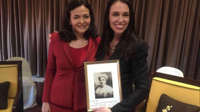 Sheryl Sandberg and New Zealand Prime Minister Jacinda Ardern with a pic of New Zealand's first suffragette, Kate Sheppherd.