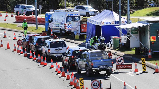 Queensland Police stop and inspect vehicles attempting to enter Queensland at Tugun outside the Gold Coast Airport border crossing. Picture: Scott Powick