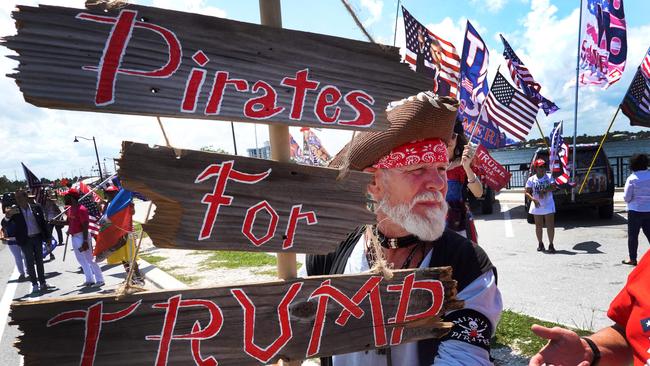 Supporters of former President Donald Trump gather near his Mar-A-Lago home after he was indicted on a new set of charges related to the mishandling of classified documents in Palm Beach, Florida. Trump is expected to be arraigned in Miami on Wednesday.