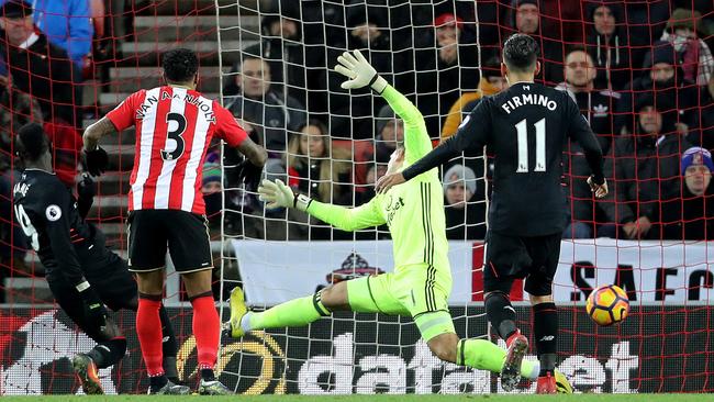 Liverpool's Sadio Mane (L) scores his side's second goal.