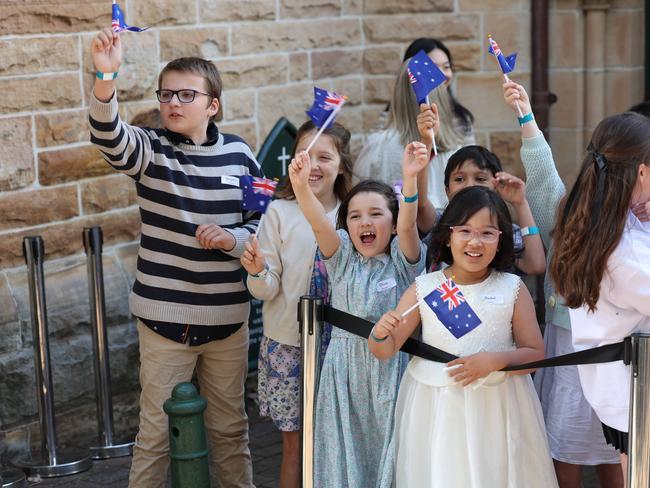 Children from Sunday school greet the royals. Picture: Rohan Kelly