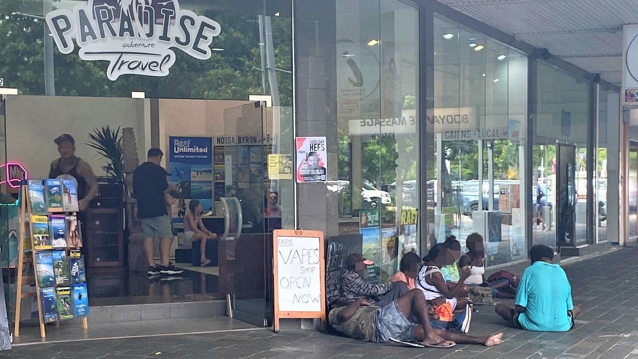 A group of itinerants on the footpath outside a business at the corner of Lake and Shields streets in the Cairns CBD. Picture: Supplied