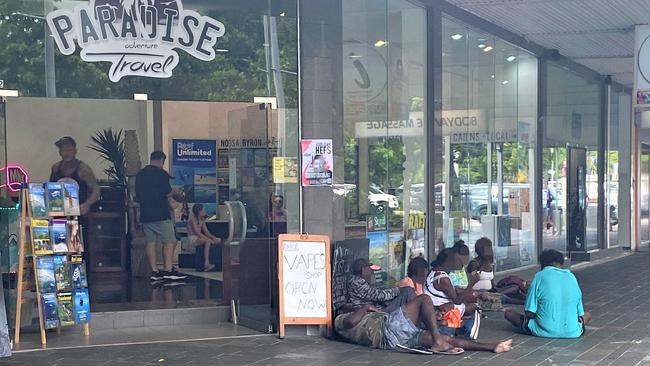 A group of itinerants on the footpath outside a business at the corner of Lake and Shields streets in the Cairns CBD. Picture: Supplied