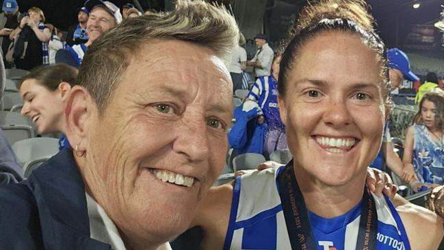 Sal Rees with North Melbourne Premiership Captain Emma Kearney after the 2024 AFLW Grand Final.