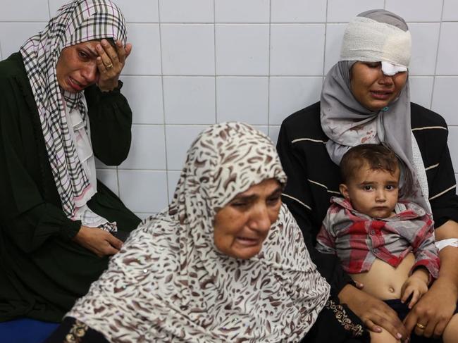 People injured during an Israeli operation in the Jabalia refugee camp waited for treatment at a Gaza City hospital on Monday. Picture: Omar Al-Qattaa/AFP/Getty Images