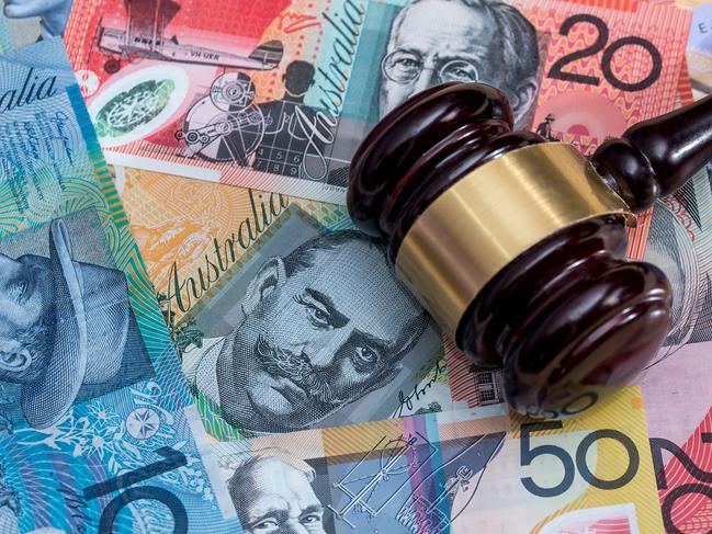 Judge gavel on australian money, law. Mallet of justice concept. Finance background