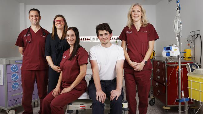 L-R Doctor Adam Mahoney director of trauma service, Clare Collins trauma program manager, Chelsey Vladic clinical nurse consultant, Harley Phipps 19, Doctor Jenny Jamieson deputy director trauma service. Harley Phipps 19 who spent an extended period of time at the Royal Hobart Hospital recovering from injuries sustained in a motorbike accident. Picture: Nikki Davis-Jones