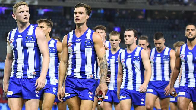 MELBOURNE, AUSTRALIA - APRIL 02: Jack Ziebell and his Kangaroos team mates look dejected after losing the round 3 AFL match between the North Melbourne Kangaroos and the Western Bulldogs at Marvel Stadium on April 02, 2021 in Melbourne, Australia. (Photo by Quinn Rooney/Getty Images)